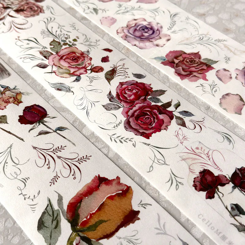 Strips of Rose Factory Japanese PET Tape floral designs laid on a textured surface