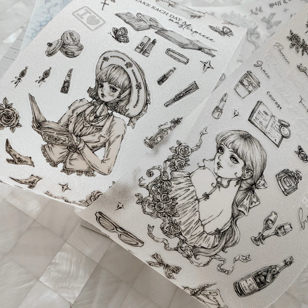 Sheet of temporary tattoos with illustrations of a girl and various items on a white background.