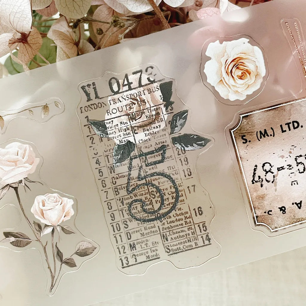 Translucent Rose Post PET Tape vintage labels with floral designs on a light background