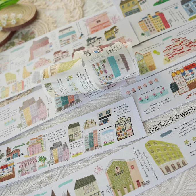 Row of Houses Washi Tape strips of illustrated buildings and text on a textured surface