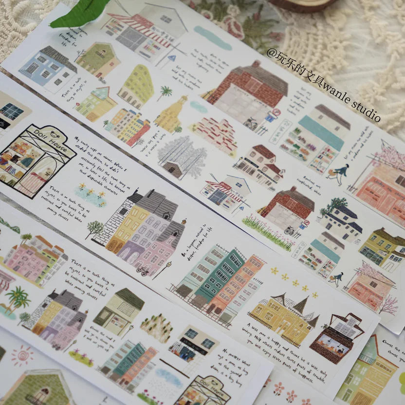 Sheet of decorative stickers with illustrated houses and text, featuring the brand 'wanle studio'.