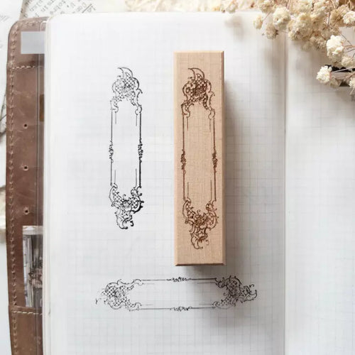 Decorative rubber stamp on a notebook with floral elements