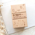 Wooden box with 'Depresso' definition and coffee bean design on a light background