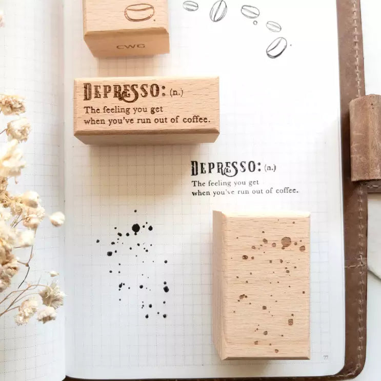 Rustic Roast stamps and Depresso impression on a notebook page with coffee beans around