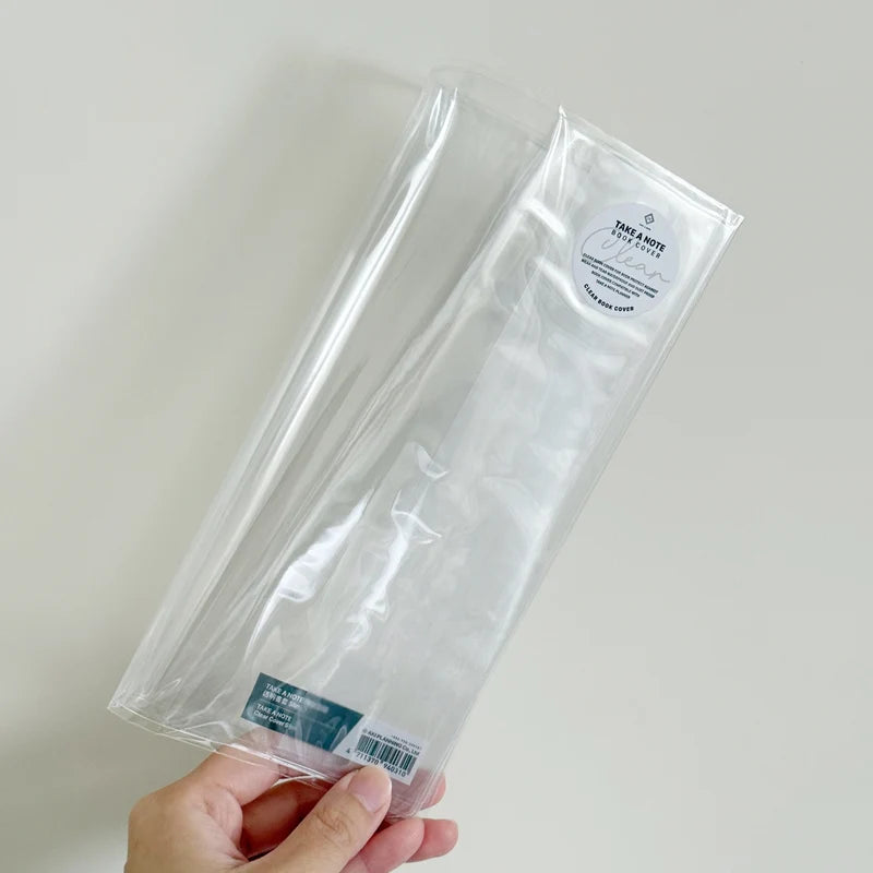 Slim Clear Cover by Take a Note — clear PVC planner cover held in hand, for journaling