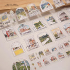 Set of decorative stickers with scenic designs on a light surface.