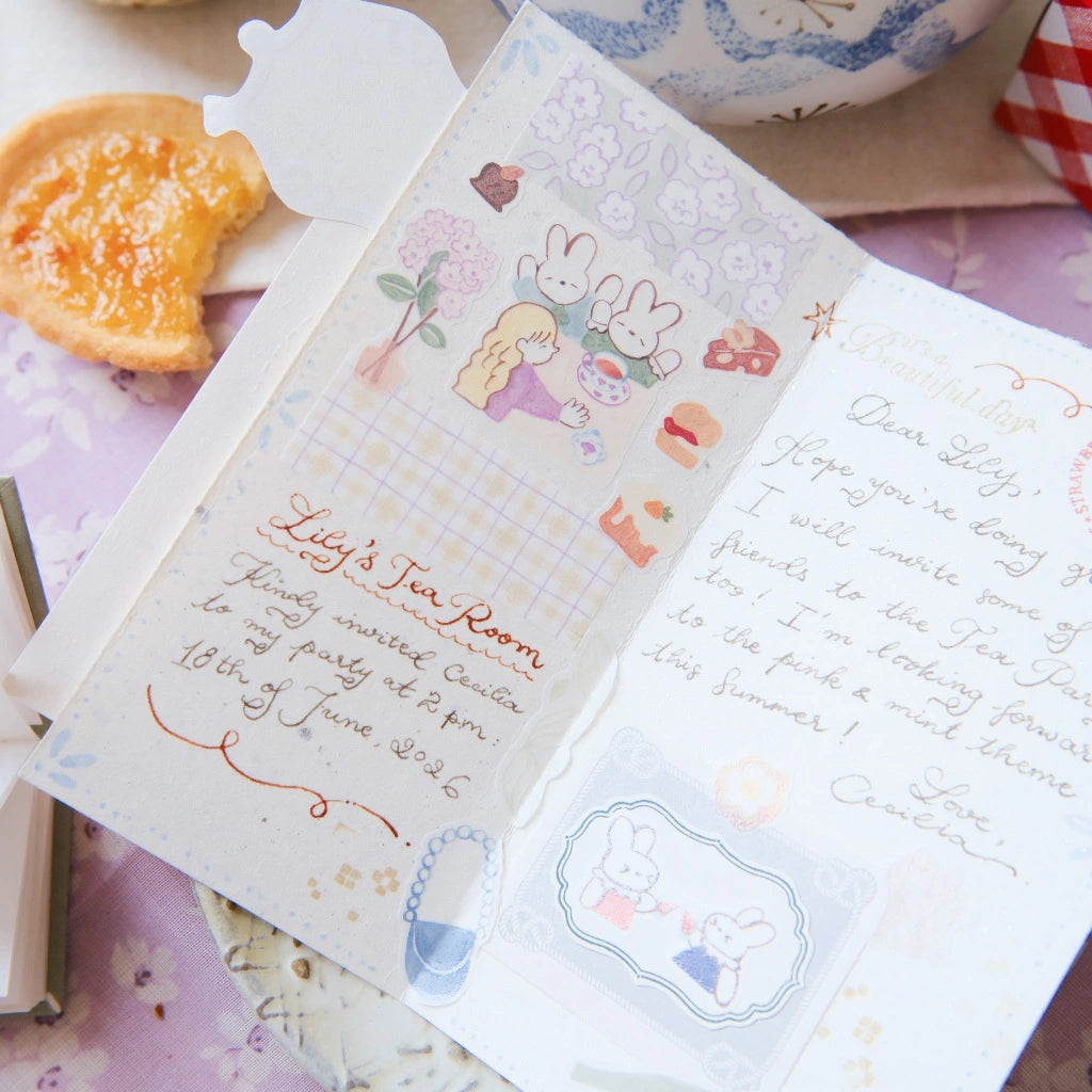 Invitation card with cartoon characters and text on a decorative surface