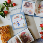 Illustrated tea packaging with decorative elements on a surface