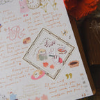 Letter with decorative elements and illustrations on a wooden surface