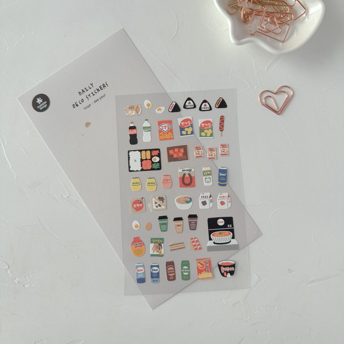 Sticker sheet with small icons and paper clips, from the See You! Sticker Sheet