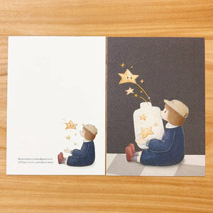 Shanni Ni 'Among Stars' Gold Foil Postcard by Yamadoro — child among stars with gold-foil map, for journaling