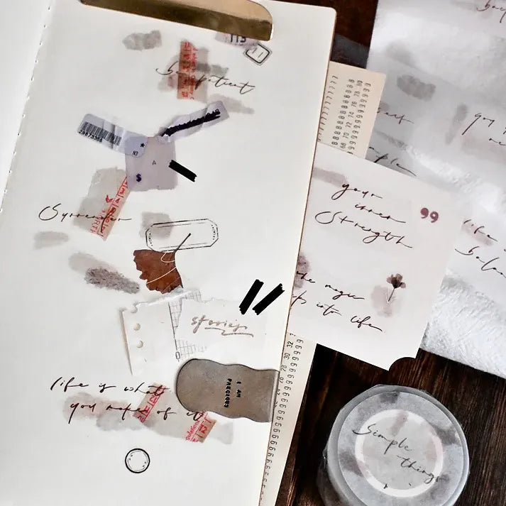 Collage of Simple Things PET Tape card-style designs with text and images on a warm wooden surface