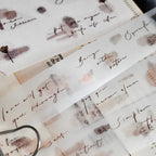 Sheet of decorative stickers with floral and script designs on a white background