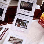 Close-up of film negatives with a KODAK box in the background