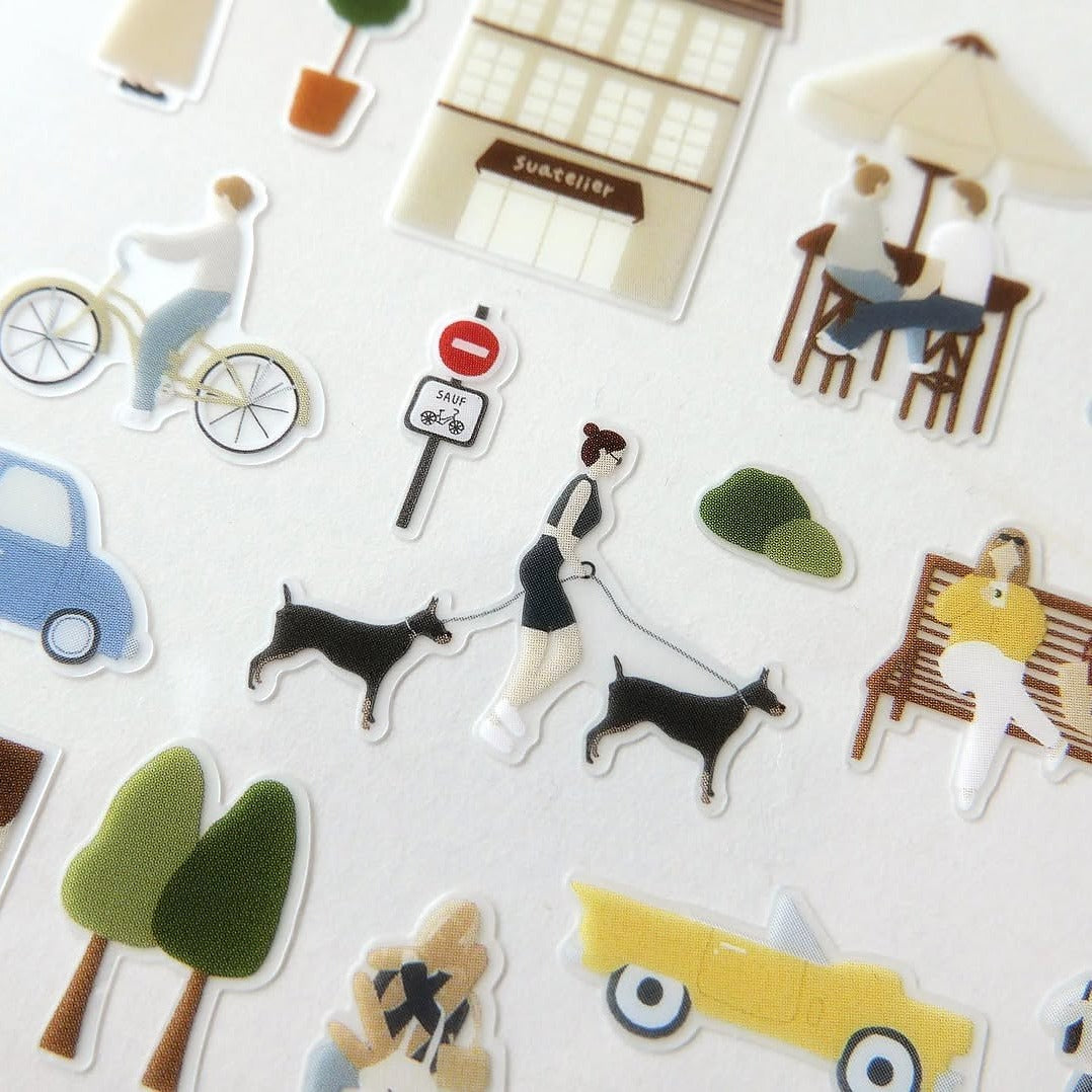 Collection of small stickers depicting various everyday scenes on a white background