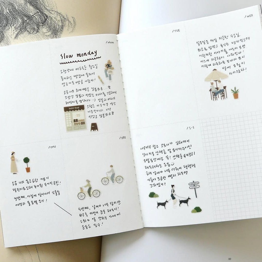 Open book with illustrations and text on a white background, from the Slow Day Sticker Sheet