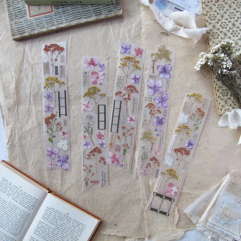 Snippets Chapter 2 PET Tape floral bookmark designs styled with an open book on texture