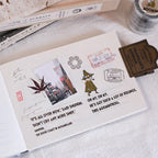 Notebook with stickers and text on a textured surface