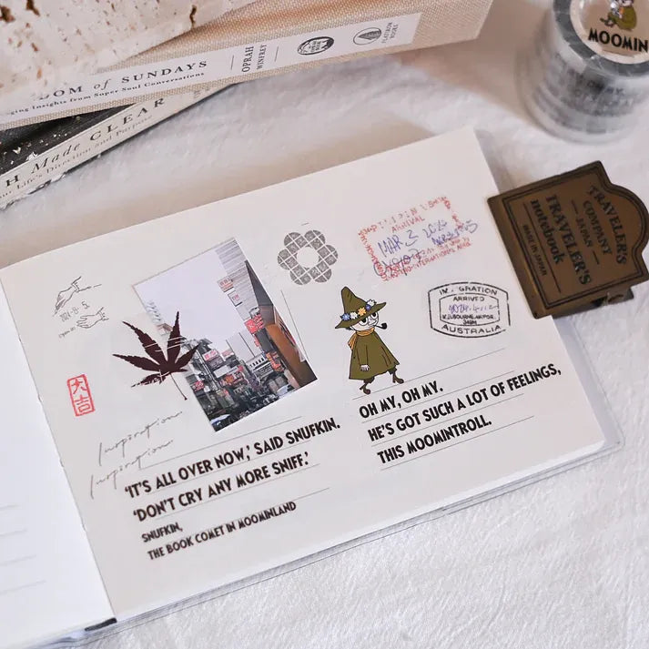 Notebook decorated with Snufkin's Philosophy ft. Moomin PET Tape stickers on a textured surface