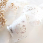 White pillows with floral patterns on a light background