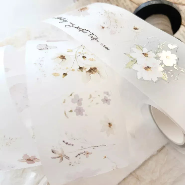 White mug decorated with Soft Days PET Tape floral design and text on light wood