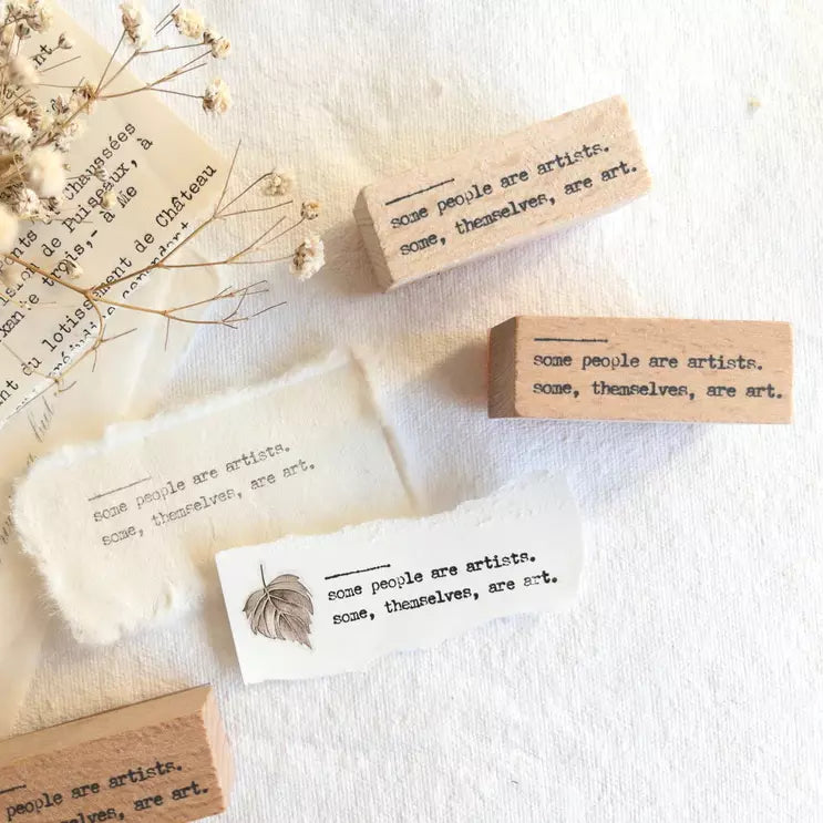 Some People Are Artists Rubber Stamp wooden blocks with engraved text and dried flowers on white