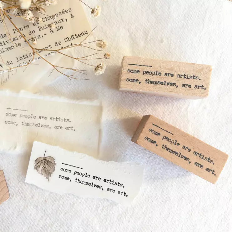 Some People Are Artists Rubber Stamp text blocks displayed together on a textured surface