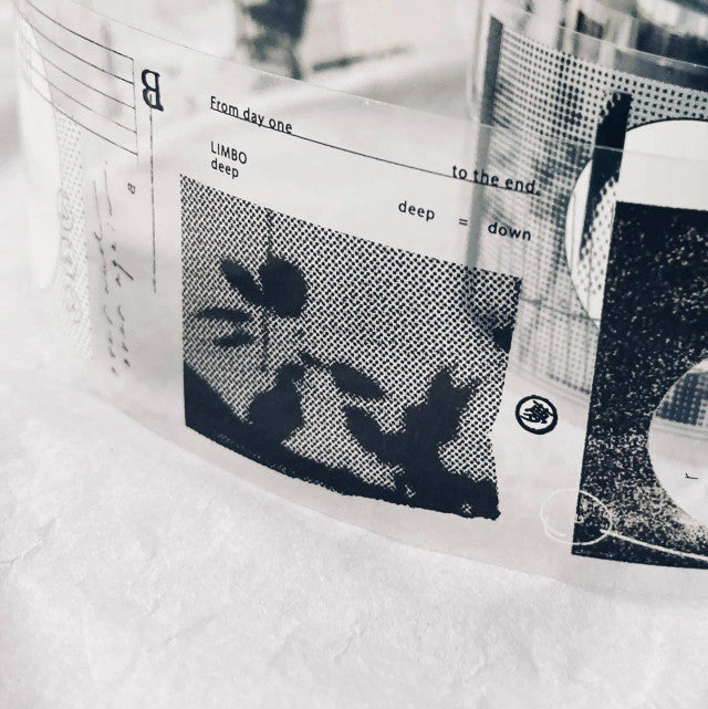 Black and white graphic design on a textured surface