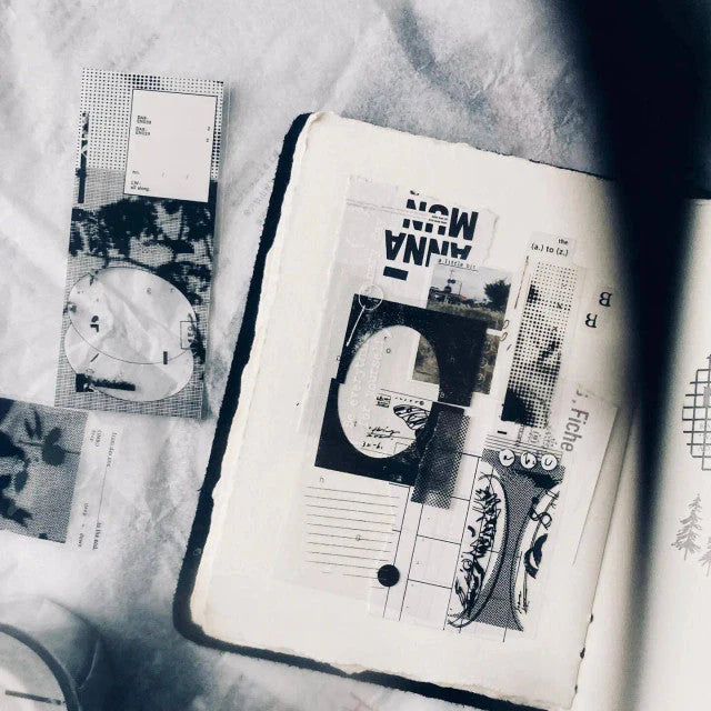 Open book decorated with a Limbo PET Tape black and white abstract design on a textured surface
