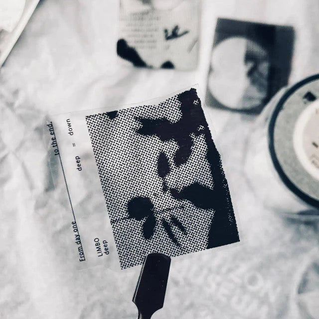 Card decorated with a monochrome Limbo PET Tape pattern displayed on a textured surface