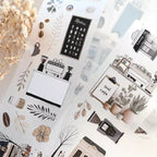 Collection of coffee-themed stationery items on a light background