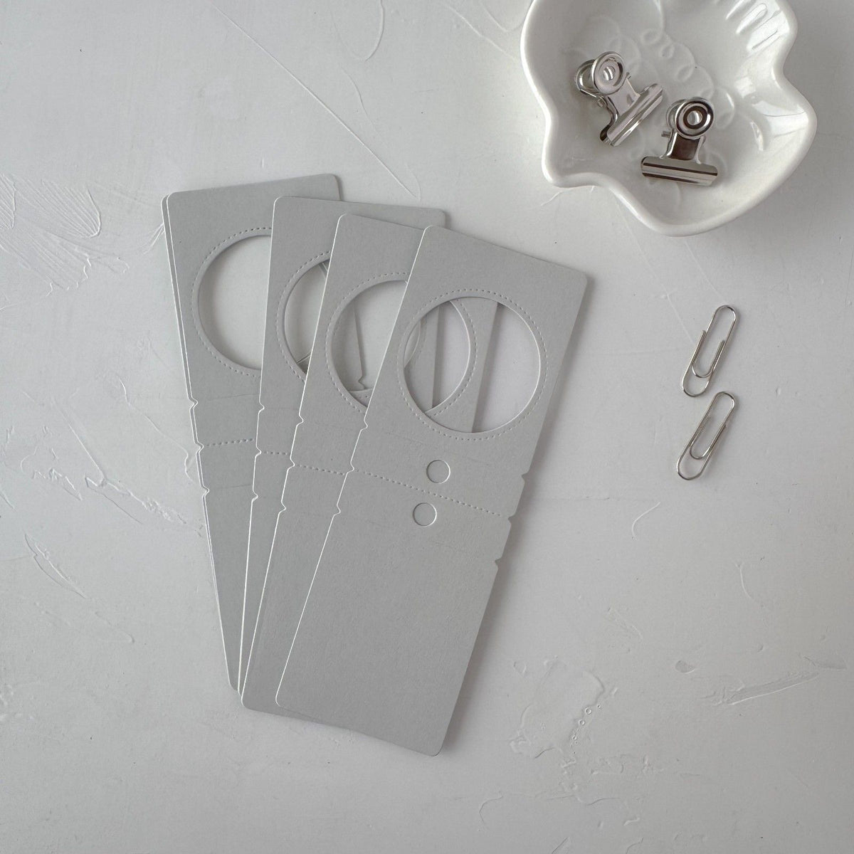 Full set of grey Specimen Card Vol. 2 cutout cards arranged on a light grey surface