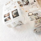Collection of photo prints on a white surface with a soft focus background