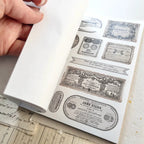 Vintage-style washi sticker book page with French label designs and typography in neutral tones