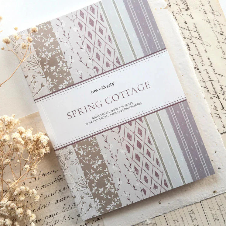 Spring Cottage Washi Sticker Book packaging with patterned designs on a textured surface