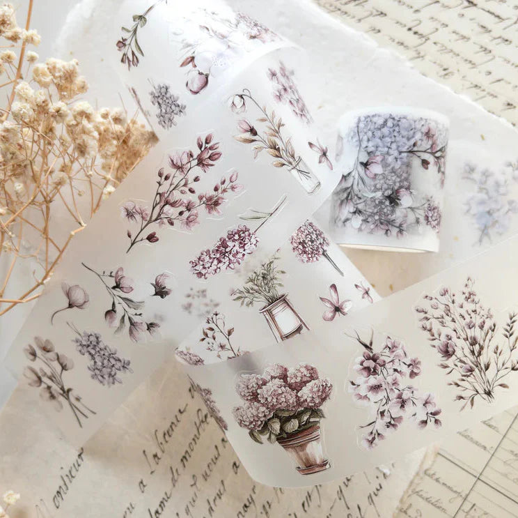 Translucent Spring Garden PET Tape sheets with floral designs on a textured surface
