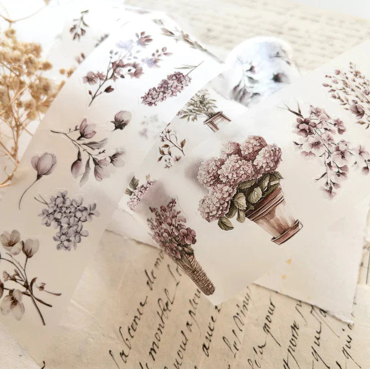Spring Garden PET Tape floral and script design elements laid on a textured surface