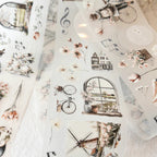 Collection of decorative stickers with vintage elements, flowers, and architectural details on a light background.