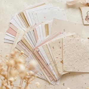 Handmade Paper Square Paper Vol. 1 textured sheets laid out on a light background