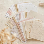 Collection of various textured paper sheets on a light background