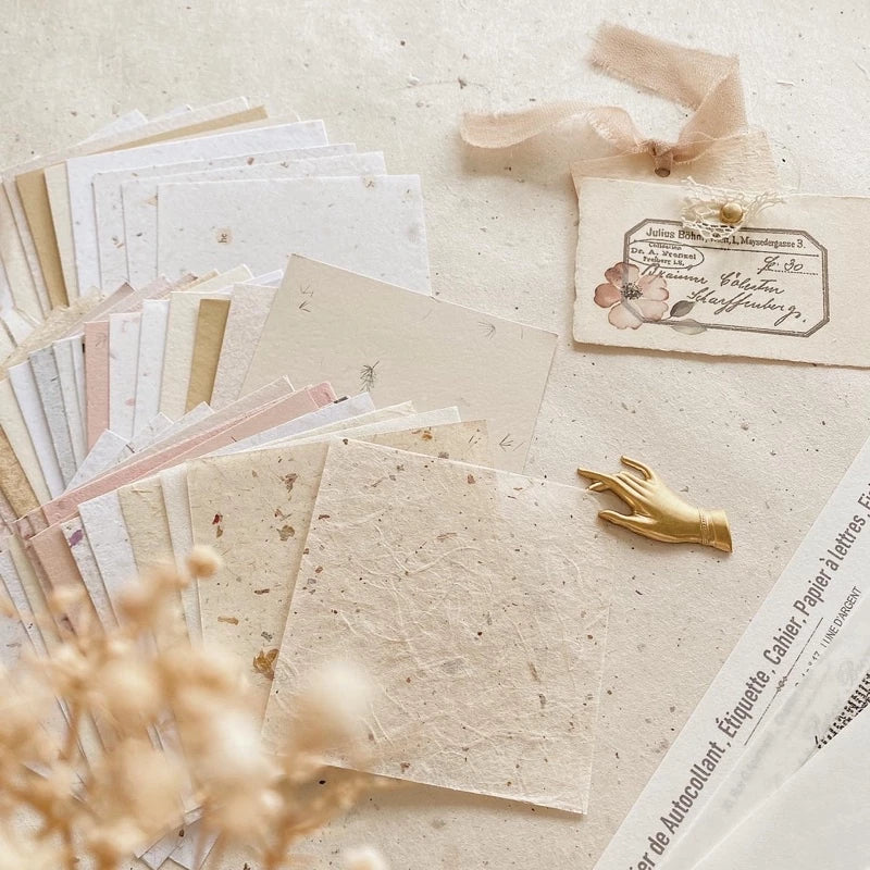 Square Paper Vol. 1 styled with vintage stationery items on a textured surface, flat lay