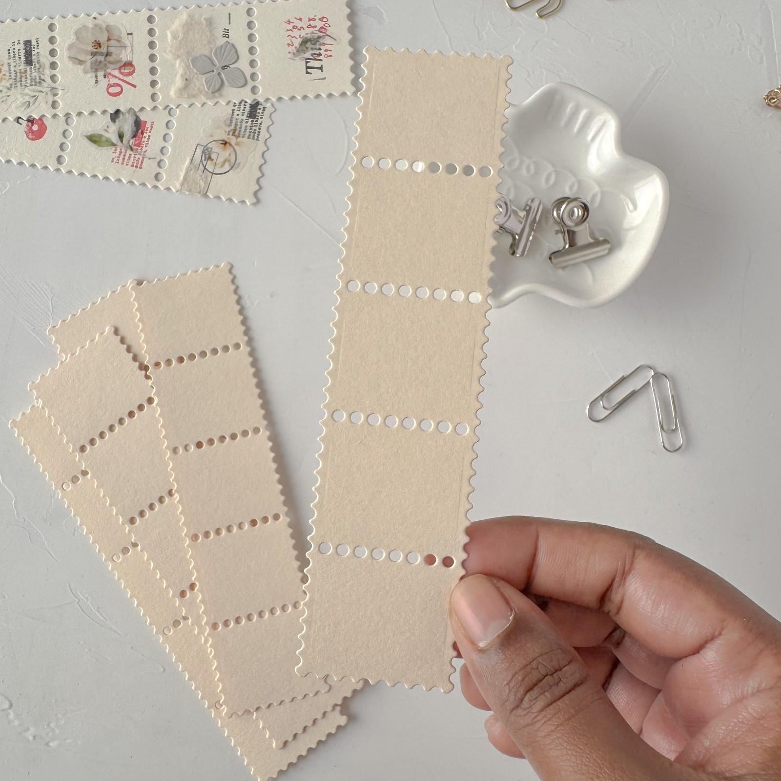 Cream Stamp Card Vol. 1 ephemera cards with decorative styling on a light grey surface