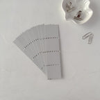 Gray fabric swatch with a grid pattern on a white background