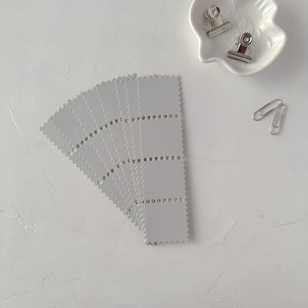 Grey Stamp Card Vol. 2 card showing its subtle grid pattern on a white background