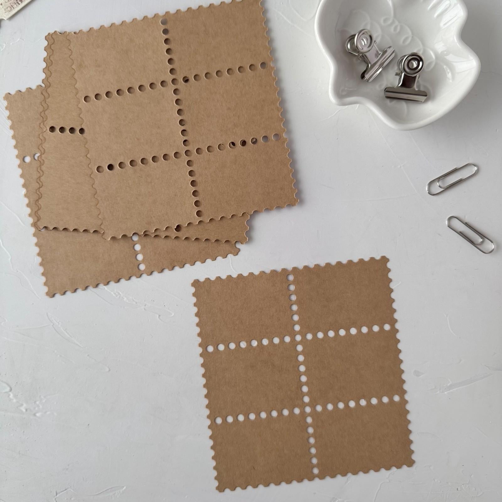 Two kraft Stamp Card Vol. 3 square cards with grid patterns displayed on a white surface