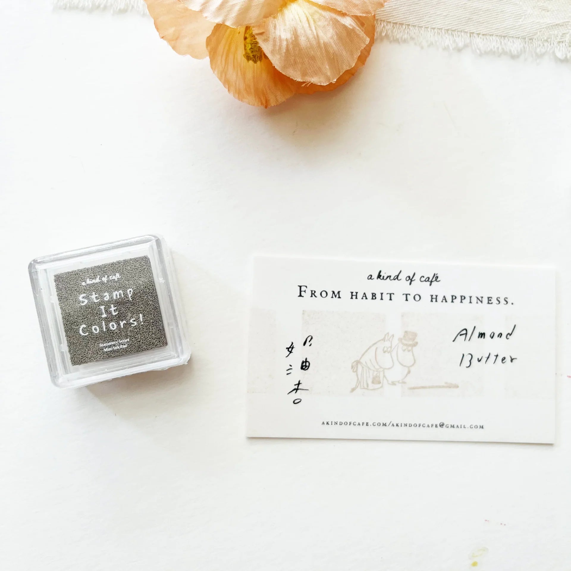 Small stamp set with a card and flower on a white background