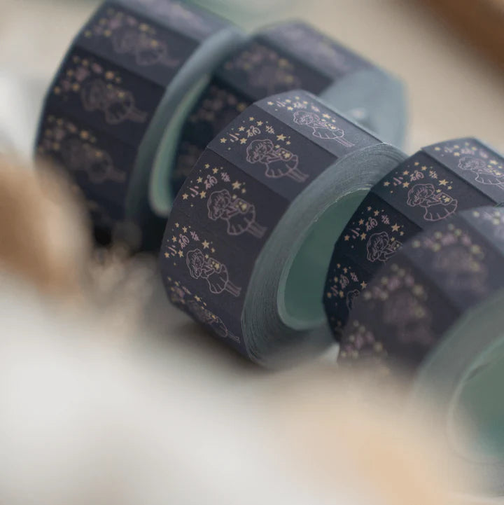 Close-up of navy Little Happiness Label Sticker Tape rolls with stars and characters