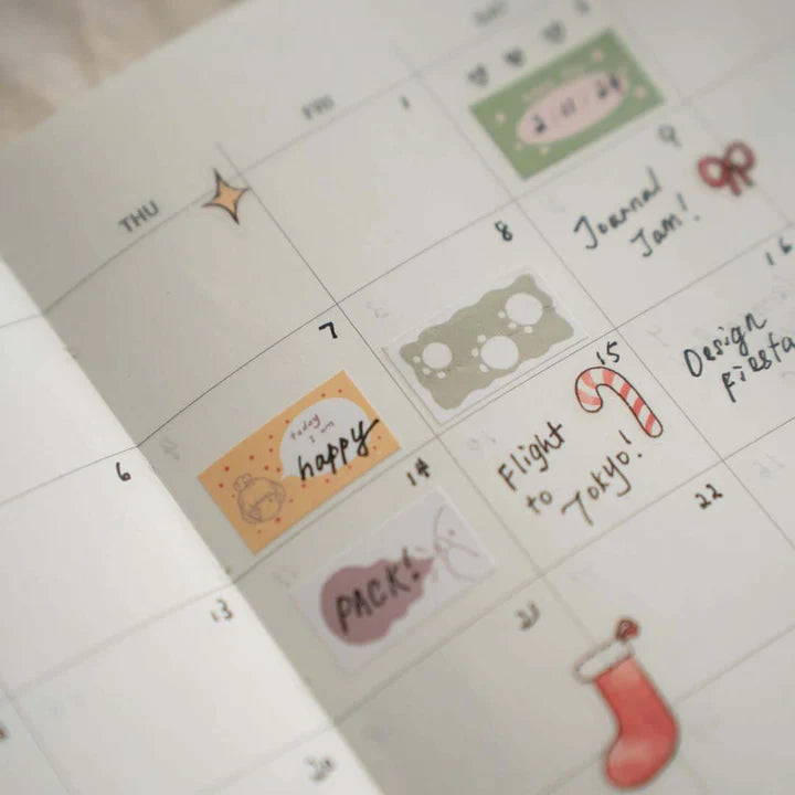 Planner page decorated with Mood Label Sticker Tape stickers and festive doodles