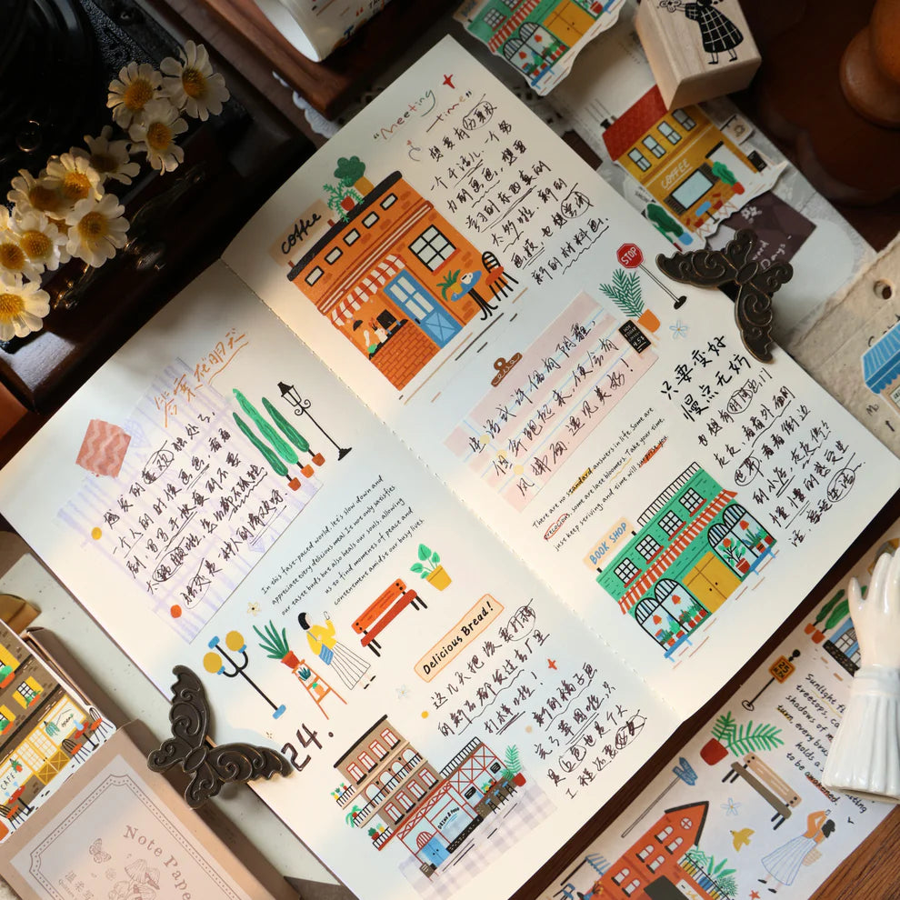 Open book with colorful illustrations and text on a wooden surface.