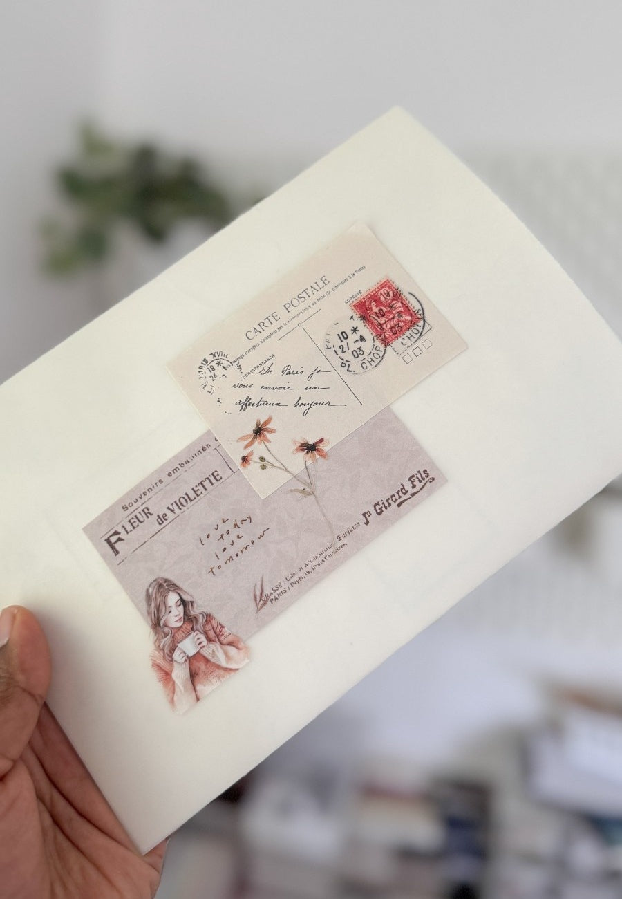 Hand holding a card with vintage-style design and text